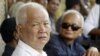 Former Khmer Rouge leaders Khieu Samphan, left, and Nuon Chea, right, look on during the funeral for Khieu Ponnary, the first wife of Khmer Rouge leader Pol Pot, in 2003. 
