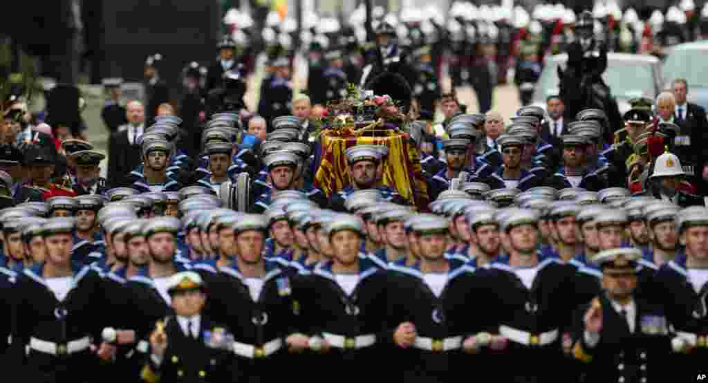 The coffin of Queen Elizabeth II is brought to Westminster Abbey for her funeral in central London, Sept. 19, 2022. 
