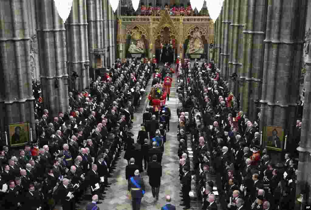 The coffin of Queen Elizabeth II is carried into Westminster Abbey in central London, Sept. 19, 2022.