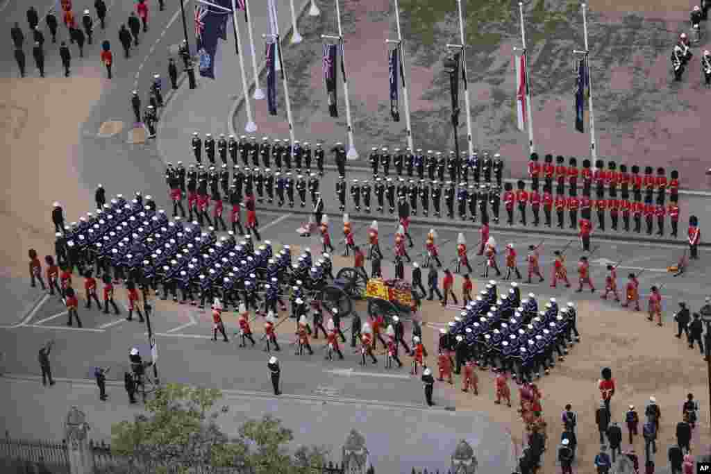 Members of the armed forces march during the funeral procession for Queen Elizabeth II in London, Sept. 19, 2022. 