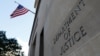 FILE - Signage is seen at the United States Department of Justice headquarters in Washington, Aug. 29, 2020. 