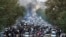 FILE - In this photo taken by an individual not employed by AP and obtained by the AP outside Iran, protesters chant slogans during a protest over the death of a woman who was detained by the morality police, in downtown Tehran, Sept. 21, 2022.