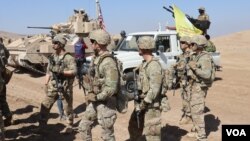 Dîmeneke Hêzên Sûrîya Demokratîk (HSD) û hêzên Koalîsyona Navneteweyî