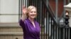 Liz Truss gestures outside the Conservative Party headquarters, after being announced as Britain's next Prime Minister, in London, Sept. 5, 2022. 