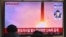 FILE - People watch a television screen broadcasting file footage of a North Korean missile test at a railway station in Seoul, South Korea, on Jan. 30, 2022.