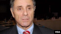 An Indian firefighter wearing a fire proximity suit walks through a wall of flames during a demonstration of firefighting skills for Fire Safety Week in Bhubaneswar. Fire Safety Week runs April 14-20 across India.