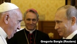 VATICAN -- Russian President Vladimir Putin (R) meets Pope Francis during a private meeting at Vatican, June 10, 2015