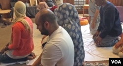 Since the birth of his daughter 11 years ago, Egyptian-born Hussam Mousa (center) stopped worshiping at mosques where men and women are separated.