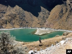 The lake is all that remains of a glacier near the rural town of Batijlaca, Bolivia. Bolivia's glaciers are melting rapidly, jeopardizing water supplies to rural and urban communities