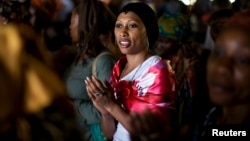 A woman sings during a prayer session at the Saint Francis Xavier parish in Yaounde, Cameroon, in this March 17, 2009 file photo. 