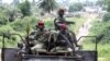 Ivory Coast Republican forces patrol near Sacre village, in the western Tai area near Ivory Coast's border with Liberia, June 17, 2012.