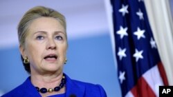 Secretary of State Hillary Clinton answers a reporter's question on Libya during a joint news conference with Brazil's Foreign Minister Antonion de Aguiar Patriota, October 24, 2012, at the State Department in Washington. 