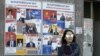 A woman walks past election posters on March 29, 2017 in Yerevan, ahead of April 2 parliamentary elections.