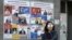 A woman walks past election posters on March 29, 2017 in Yerevan, ahead of April 2 parliamentary elections.