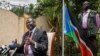 FILE - South Sudan's rebel leader Riek Machar, left, speaks to the media about the situation in South Sudan following last week's peace agreement with the government, in Addis Ababa, Ethiopia,Aug. 31, 2015. 