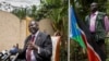 FILE - South Sudan's rebel leader Riek Machar, left, speaks to the media about the situation in South Sudan.