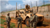 FILE - U.S. Army soldiers discuss security operations during a patrol in Somalia in December 2019. (Nick Kibbey/U.S. Air Force)