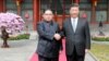 North Korean leader Kim Jong Un shakes hands with Chinese President Xi Jinping in Beijing, as he paid an unofficial visit to China, in this undated photo released by North Korea's Korean Central News Agency in Pyongyang, March 28, 2018. 