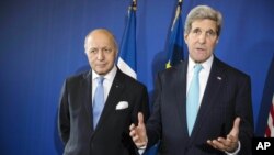 Nepalese gather to attend a candlelight vigil over an art of Dharhara Tower and Kasthamandap temple to mark the one year anniversary of devastating earthquake in Kathmandu, Nepal.