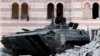 A damaged Syrian military tank is seen at the border town of Azaz, about 20 miles north of Aleppo, Syria, July 24, 2012.