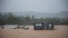 A home is submerged in floodwaters caused by Hurricane Fiona in Cayey, Puerto Rico, Sept. 18, 2022.
