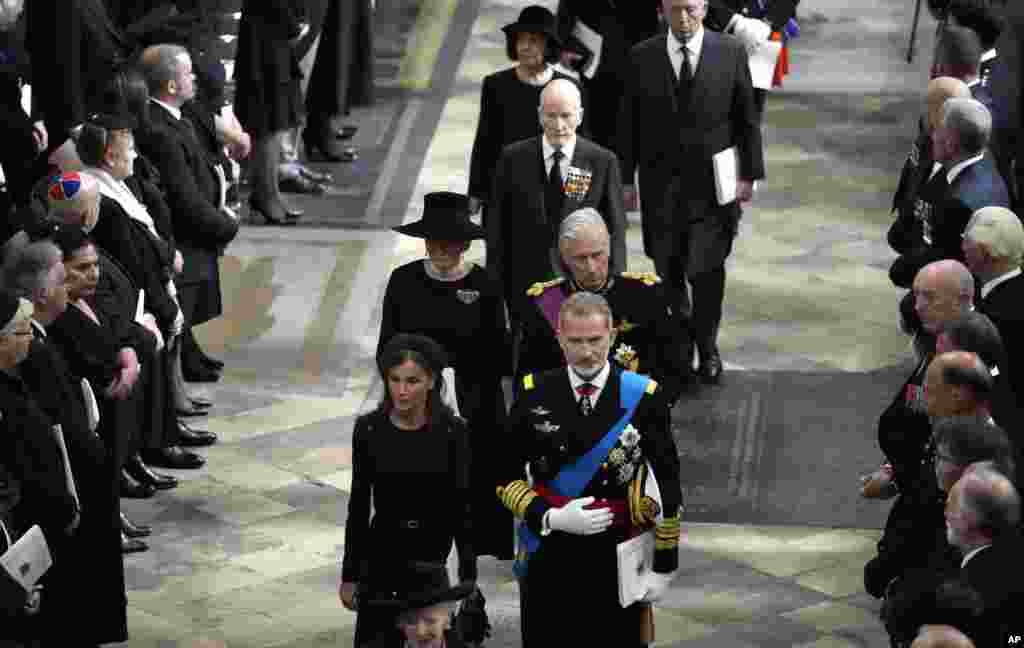 Spain's King Felipe VI, front left, and Queen Letizia, front right, walks with Belgium's King Philippe and Queen Mathilde during the State Funeral of Queen Elizabeth II at Westminster Abbey in central London, Sept. 19, 2022. 