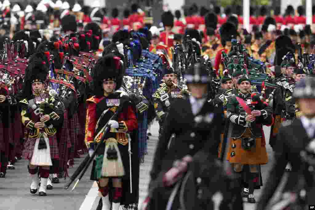 The coffin of Queen Elizabeth II is carried into Westminster Abbey for her funeral in central London, Sept. 19, 2022. 