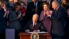 President Joe Biden signs the "Infrastructure Investment and Jobs Act" during an event on the South Lawn of the White House, Nov. 15, 2021.