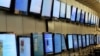 FILE - Customers look at a display of flat screened television at a Best Buy store Apr. 2009 in San Francisco, California. 