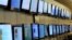 FILE - Customers look at a display of flat screened television at a Best Buy store Apr. 2009 in San Francisco, California. 