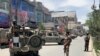 Afghan security personnel arrive at the site where gunmen attacked, in Kabul, Afghanistan, May 12, 2020.