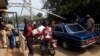 FILE - Security guards check vehicles leaving Nigeria for Cameroon at a border checkpoint in Mfum, in Cross Rivers State, southeast Nigeria, Feb. 1, 2018.
