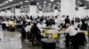 Election workers count absentee ballots sent in for the 2020 U.S. election at TCF Center in Detroit, Michigan, Nov. 4, 2020.