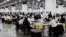 Election workers count absentee ballots sent in for the 2020 U.S. election at TCF Center in Detroit, Michigan, Nov. 4, 2020.