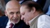 FILE - Afghan President Ashraf Ghani (l) talks with Pakistani Prime Minister Nawaz Sharif in Islamabad, Pakistan. After a recent brutal bombing in Kabul that killed 64 people and wounded 340, an outraged Ghani said he was no longer interested in Pakistan’s help to bring the Taliban to the negotiating table and instead he wanted Pakistan to launch an all-out operation against the Haqqani network on its territory. 