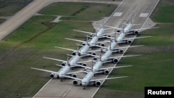 American Airlines passenger planes are parked on a runway due to flight reductions to slow the spread of coronavirus disease (COVID-19), at Tulsa International Airport in Tulsa, Oklahoma, March 23, 2020.