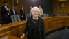 Janet Yellen, President Obama's nominee to succeed Ben Bernanke as Federal Reserve chairman, smiles after finishing her confirmation hearing before the Senate Banking Committee on Capitol Hill in Washington, Nov. 14, 2013. 
