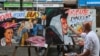 An artist from Gurukul art school works on a poster in Mumbai, India, Aug. 27, 2021, paying tribute to victims of deadly attacks at the airport in Kabul, Afghanistan.