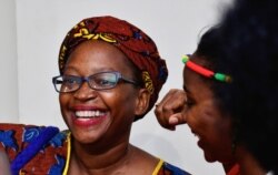 FILE - Ugandan prominent academic Stella Nyanzi reacts after the court quashed her conviction and jail term, in Kampala, Feb. 20, 2020.