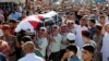 Jordanian soldiers and relatives of Belal Al-Zuhbe, one of the solders killed in an attack on a border military post near a camp for Syrian refugees, carry his body during his funeral at Nahleh village in the city of Jerash, north of Amman, Jordan, June 2