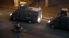 Police vehicles are seen in central Cairo as protesters gather, shouting anti-government slogans, Sept. 21, 2019.