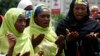 Muslim women pray at a meeting calling on the government to rescue the kidnapped girls of the government secondary school in Chibok, in Abuja, Nigeria, May 27, 2014. 