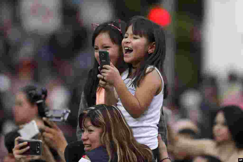 Local residents enjoy the Day of the Dead parade on Mexico City's main Reforma Avenue, Oct. 28, 2017. 
