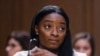 FILE - United States Olympic gymnast Simone Biles testifies during a Senate Judiciary hearing about the Inspector General's report on the FBI's handling of the Larry Nassar investigation on Capitol Hill, Sept. 15, 2021, in Washington. 