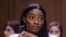 FILE - United States Olympic gymnast Simone Biles testifies during a Senate Judiciary hearing about the Inspector General's report on the FBI's handling of the Larry Nassar investigation on Capitol Hill, Sept. 15, 2021, in Washington. 