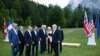 Britain's Prime Minister Boris Johnson, second right, speaks with from left, European Council President Charles Michel, Italy's Prime Minister Mario Draghi, Germany's Chancellor Olaf Scholz, France's President Emmanuel Macron, US President Joe Biden, Eur
