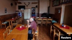 A customer drinks a beer inside the U Kryslu pub in the village of Sec near the town of Blovice, Czech Republic, June 28, 2022. (REUTERS/David W Cerny)