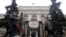 People walk past the Central Bank headquarters in Moscow, Russia on Feb. 11, 2019.