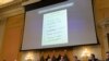 A note is displayed as the House select committee investigating the Jan. 6 attack on the U.S. Capitol holds a hearing at the Capitol on June 28, 2022. 