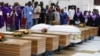Coffins are pictured during a une 17, 2022, memorial service for victims killed during an attack by gunmen during a June 5 mass at St. Francis Catholic Church, in Owo, Ondo, Nigeria. 